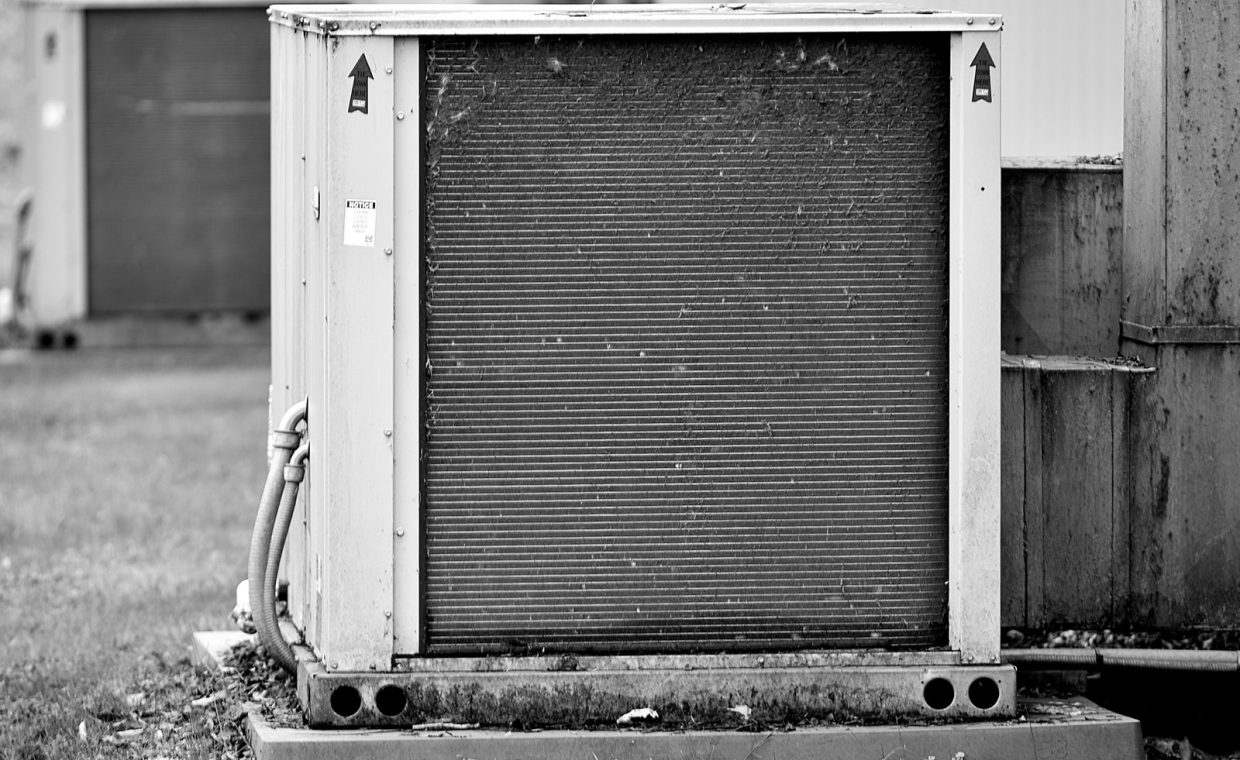 Close-up of an industrial HVAC unit outdoors, showcasing its metal texture.
