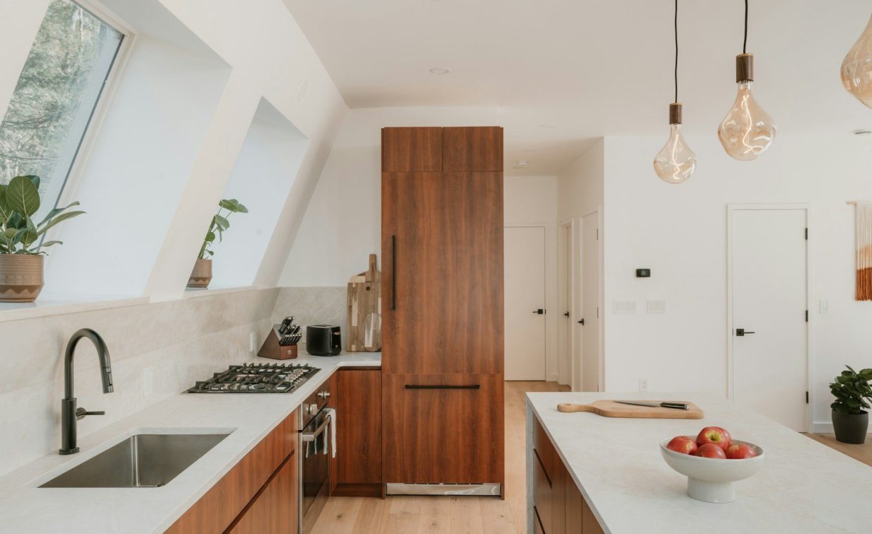 Modern kitchen with wooden cabinets and island.