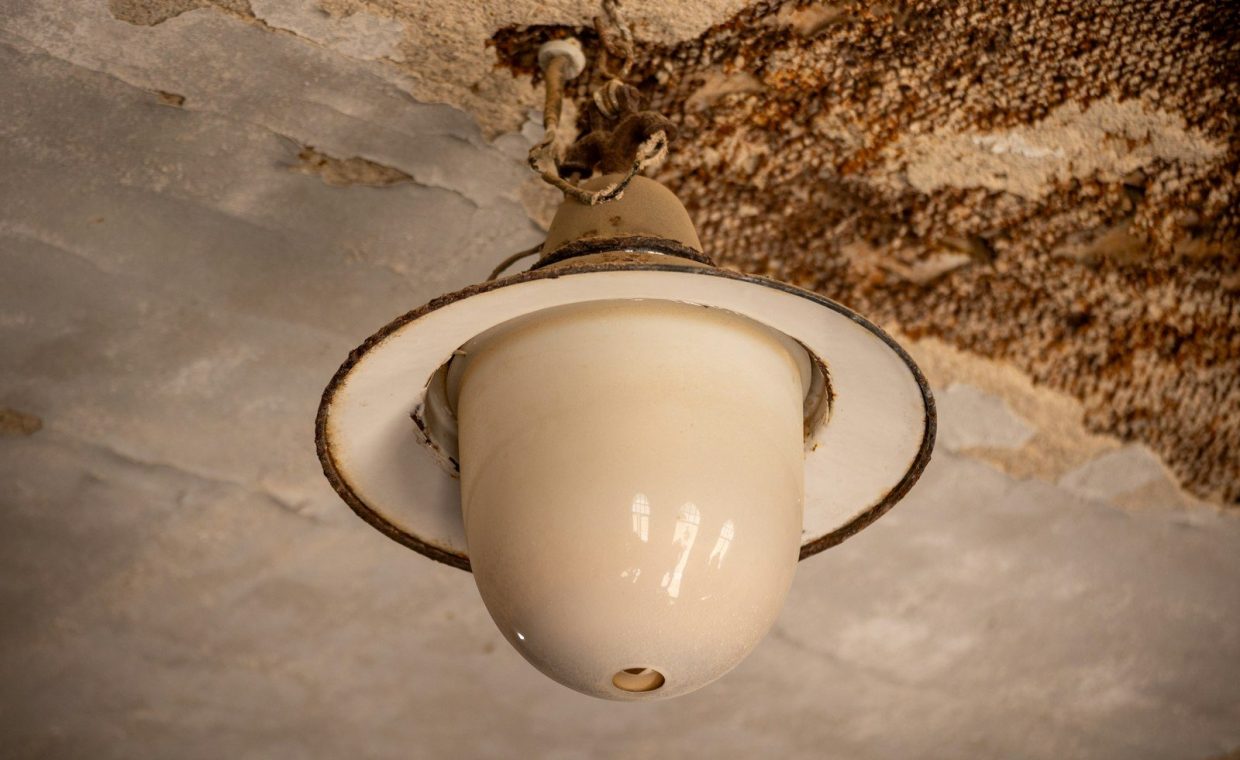 Vintage ceiling light fixture with aged texture